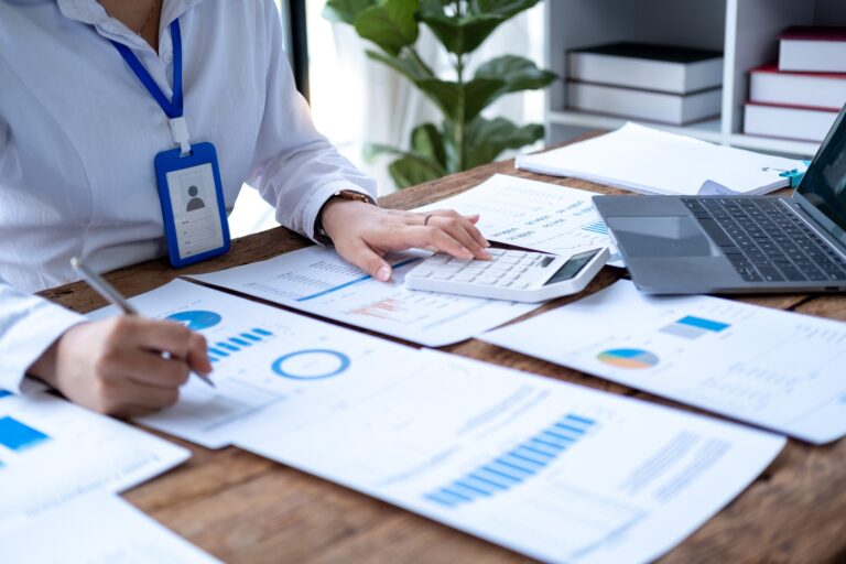 person doing manual billing across their desk