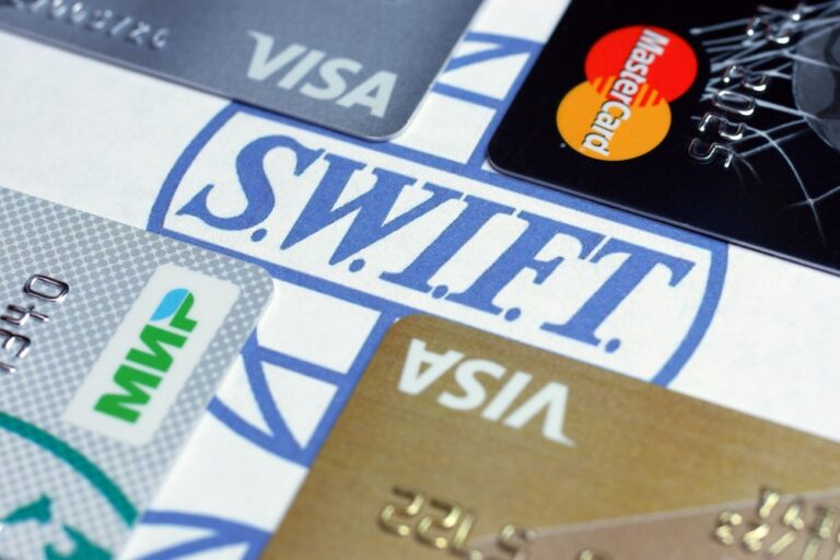 S.W.I.F.T logo surrounded by credit cards
