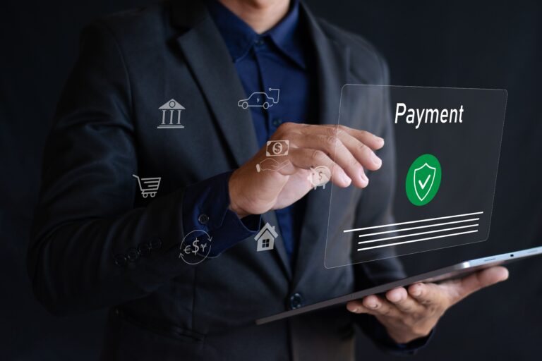 person in business suit with hand reaching towards payment hologram