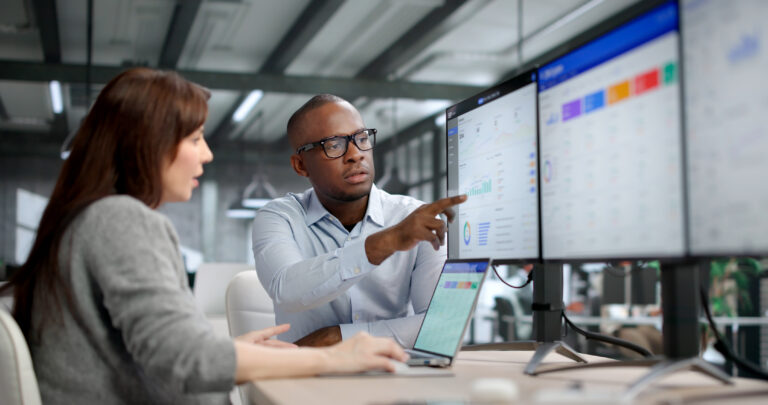 Two colleagues looking at ERP software